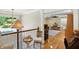 Loft with seating and view of living room, featuring hardwood floors and decorative lighting at 2227 Hidden Orchard Ct, Indianapolis, IN 46228