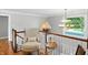 Cozy loft area featuring a comfortable chair, decorative accents, and a view of the staircase at 2227 Hidden Orchard Ct, Indianapolis, IN 46228