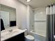 Bathroom with large vanity, dark accents, and bath/shower with gray accents at 2232 Warbler St, Danville, IN 46122