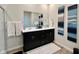 Bathroom featuring a double vanity with a large mirror, tasteful decorations, and wood look flooring at 2232 Warbler St, Danville, IN 46122