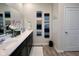 Bathroom featuring a double vanity with a large mirror, tasteful decorations, and wood look flooring at 2232 Warbler St, Danville, IN 46122