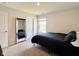 Bedroom with neutral walls and carpet, large mirror, and modern queen size bed at 2232 Warbler St, Danville, IN 46122