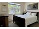 Bedroom featuring one window, a dark wood bed, wood dresser and simple decor at 2232 Warbler St, Danville, IN 46122