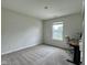 Bedroom with neutral walls and carpet, well-lit with a large window and a desk at 2232 Warbler St, Danville, IN 46122