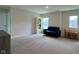 Spacious bonus room featuring a cozy couch, table, chairs and shelving at 2232 Warbler St, Danville, IN 46122