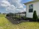 Exterior view of a home with a black fence, neat landscaping, and a green lawn at 2232 Warbler St, Danville, IN 46122