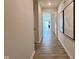 Entry hallway with wood flooring and neutral walls leading into the rest of the house at 2232 Warbler St, Danville, IN 46122