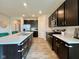 Kitchen featuring dark cabinetry, stainless steel appliances, and ample counter space at 2232 Warbler St, Danville, IN 46122