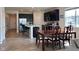 Open-concept kitchen and dining area with a view of the living room and modern finishes at 2232 Warbler St, Danville, IN 46122