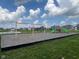 A new playground offers swings and slides in a manicured green space near a pond at 2232 Warbler St, Danville, IN 46122