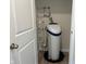 A clean and modern water softener sits in an organized utility closet at 2232 Warbler St, Danville, IN 46122