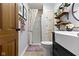 The stylish bathroom features a vanity, mirror, and shower, designed for comfort and efficiency at 2315 Elm Swamp Rd, Lebanon, IN 46052