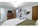 Comfortable bedroom with traditional furnishings, complemented by natural wood doors and trim at 2315 Elm Swamp Rd, Lebanon, IN 46052