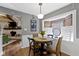 Charming dining area with round table, window views and direct access to the living room and kitchen at 2315 Elm Swamp Rd, Lebanon, IN 46052