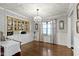 Elegant dining room with decorative lighting, built-in cabinet, and large window enhancing the room's brightness at 2315 Elm Swamp Rd, Lebanon, IN 46052