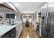 Bright kitchen featuring stainless steel appliances, granite countertops, and an adjacent dining area at 2315 Elm Swamp Rd, Lebanon, IN 46052