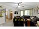 Inviting living room with comfortable sectional sofa and ceiling fan at 2315 Elm Swamp Rd, Lebanon, IN 46052