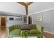 Comfortable living room showcasing a view to the kitchen, wood floors, and a stylish sofa at 2315 Elm Swamp Rd, Lebanon, IN 46052