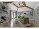 Beautiful living room with wood floors, fireplace, sliding glass doors to the yard, and an open view to the kitchen at 2315 Elm Swamp Rd, Lebanon, IN 46052