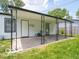 View of a covered back porch with decorative metal supports and access to the backyard at 3101 Gerrard Ave, Indianapolis, IN 46224