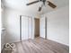 Bright bedroom with laminate flooring and a ceiling fan at 3101 Gerrard Ave, Indianapolis, IN 46224
