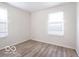 Inviting bedroom with laminate flooring and natural light at 3101 Gerrard Ave, Indianapolis, IN 46224