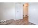 Cozy bedroom with a closet, laminate flooring, and neutral paint at 3101 Gerrard Ave, Indianapolis, IN 46224