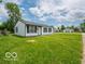 Attractive home featuring a manicured lawn, a welcoming front door, and a serene neighborhood setting at 3101 Gerrard Ave, Indianapolis, IN 46224