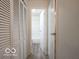 Hallway with closet featuring louvered doors with a door at the end of the hallway at 3101 Gerrard Ave, Indianapolis, IN 46224