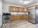 Functional kitchen with wooden cabinets and stainless steel appliances at 3101 Gerrard Ave, Indianapolis, IN 46224
