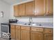 Kitchen with wooden cabinets, stainless steel appliances, and plenty of counter space at 3101 Gerrard Ave, Indianapolis, IN 46224