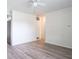 Bright living room featuring laminate flooring and a ceiling fan at 3101 Gerrard Ave, Indianapolis, IN 46224