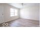 Inviting living room with modern flooring, fresh paint, and ample natural light at 3101 Gerrard Ave, Indianapolis, IN 46224