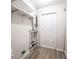 Utility room with open shelves and white door with a vent for ventilation at 3101 Gerrard Ave, Indianapolis, IN 46224