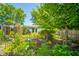 A beautiful landscaped backyard featuring multiple plants, shrubs, and flowers at 317 Stoner Dr, Anderson, IN 46013