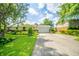 Charming home with mature trees and colorful garden at 317 Stoner Dr, Anderson, IN 46013