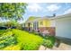 A home with colorful yard decor and manicured garden at 317 Stoner Dr, Anderson, IN 46013