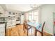 Inviting kitchen with a dining area with white cabinets and stainless steel appliances at 317 Stoner Dr, Anderson, IN 46013
