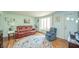 Cozy living room featuring hardwood floors, ample seating, and abundant natural light at 317 Stoner Dr, Anderson, IN 46013