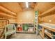 The backyard storage shed offers lots of shelves, places for equipment, and plenty of work space at 317 Stoner Dr, Anderson, IN 46013