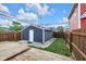 A backyard with wood deck area and garage on a sunny day at 329 Parkway Ave, Indianapolis, IN 46225