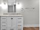 This bathroom features a granite countertop with gray cabinets and modern hardware at 329 Parkway Ave, Indianapolis, IN 46225