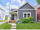 Charming home with a well-maintained lawn and a welcoming front porch at 329 Parkway Ave, Indianapolis, IN 46225