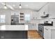 Modern kitchen featuring stainless steel appliances and a large island at 329 Parkway Ave, Indianapolis, IN 46225