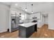 Modern kitchen with white cabinets and stainless steel appliances at 329 Parkway Ave, Indianapolis, IN 46225