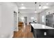 Open concept kitchen and living room with lots of natural light and hardwood floors at 329 Parkway Ave, Indianapolis, IN 46225