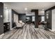 Spacious basement featuring modern gray walls, stylish seating area, and built-in bar with wine storage at 350 N Meridian St # 606/607, Indianapolis, IN 46204