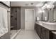Modern bathroom featuring double sinks, sleek vanity, and a glass-enclosed shower with stylish tile at 350 N Meridian St # 606/607, Indianapolis, IN 46204