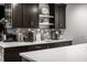 Close up on stylish dark cabinets and stainless appliances, featuring a white countertop and backsplash at 350 N Meridian St # 606/607, Indianapolis, IN 46204