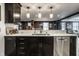 Stylish kitchen with dark cabinets, stainless steel appliances, white countertops and stainless faucet at 350 N Meridian St # 606/607, Indianapolis, IN 46204
